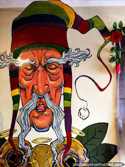 Spectacular mural of an old grey man with a very colorful hat in a cafe in Copacabana. (480x640px). Bolivia, South America.