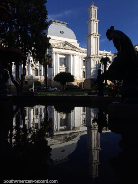 Reflection in the water of the stunning supreme court building in Sucre and 2nd Obelisco column. (480x640px). Bolivia, South America.