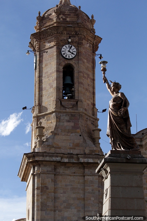 The liberty statue alongside the cathedral tower in Potosi, view from the plaza. (480x720px). Bolivia, South America.