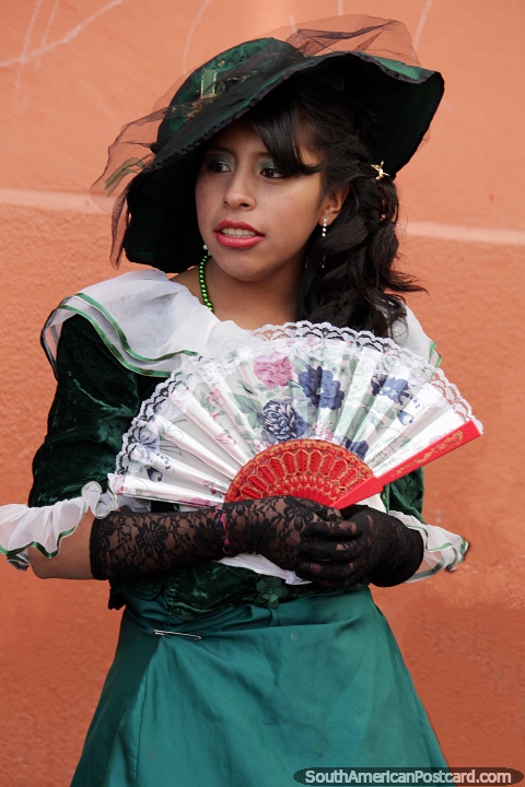 Nice fan, nice hat, nice dress, nice girl, the ladies of Potosi. (480x720px). Bolivia, South America.