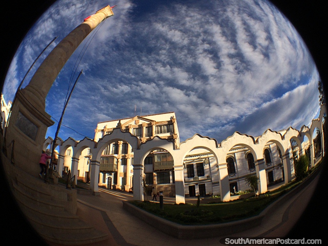 Iconic white arches and tall monument in Plaza 6th of August in Potosi. (640x480px). Bolivia, South America.