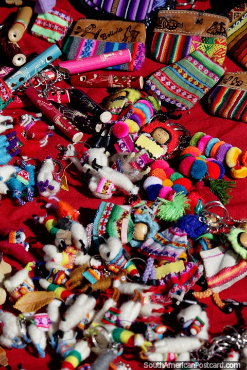 A range of cute colorful key-rings with chains, souvenirs at the Tarabuco market. (480x720px). Bolivia, South America.