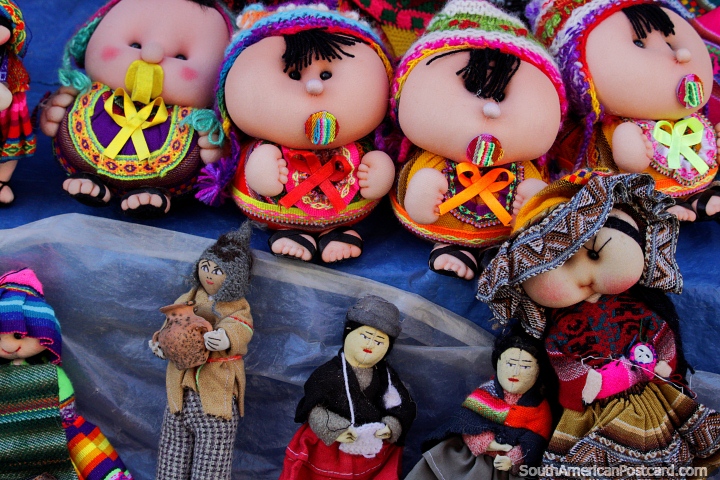 Dolls of babies sucking dummies and small indigenous folk, souvenirs to buy at Tarabuco market. (720x480px). Bolivia, South America.