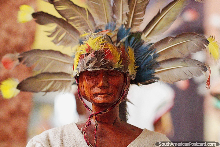 Machetero de Magdalena, indigenous man with feather head-wear, Kenneth Lee Museum in Trinidad. (720x480px). Bolivia, South America.