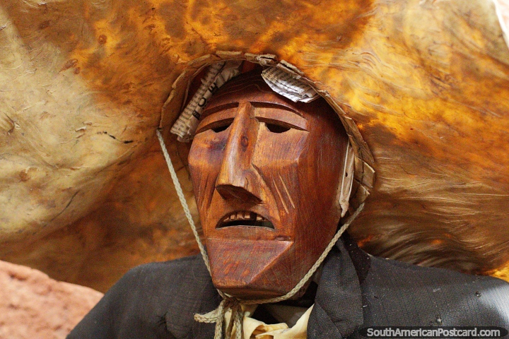 Wooden figure wearing a large leather hat, traditional culture at Kenneth Lee Museum in Trinidad. (720x480px). Bolivia, South America.
