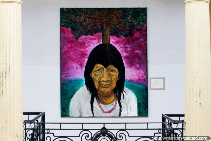 Indigenous man with a tree behind him, painting called The Last Pacahuara by W. Santiago Toro in Santa Cruz. (720x480px). Bolivia, South America.