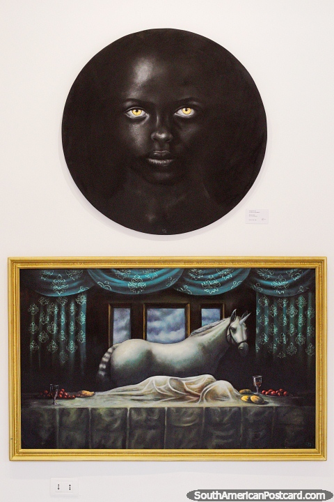 2 paintings by Douglas Rivera on exhibition at Melchor Pinto House in Santa Cruz, black face and a horse. (480x720px). Bolivia, South America.