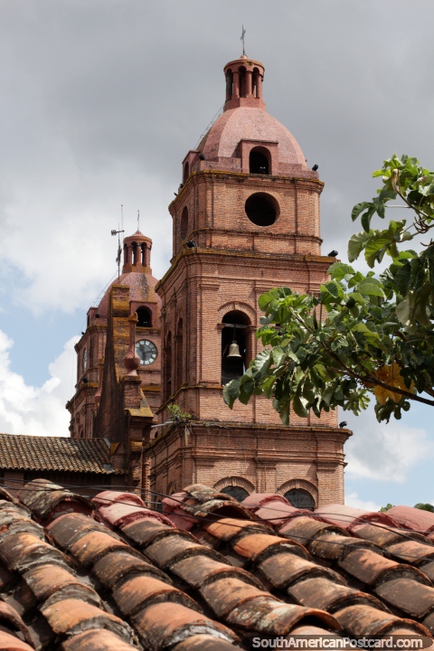 Cathedral Basilica of St. Lawrence in Santa Cruz, the bell tower and clock tower, red brick construction. (480x720px). Bolivia, South America.