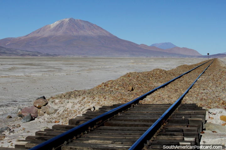 Train tracks and beautiful mountains in the cool crisp morning in the Uyuni desert. (720x480px). Bolivia, South America.
