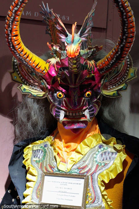 Purple face, yellow horns and small tusks, the Devils mask from 1990, the history of carnival at the Anthropological Museum in Oruro. (480x720px). Bolivia, South America.
