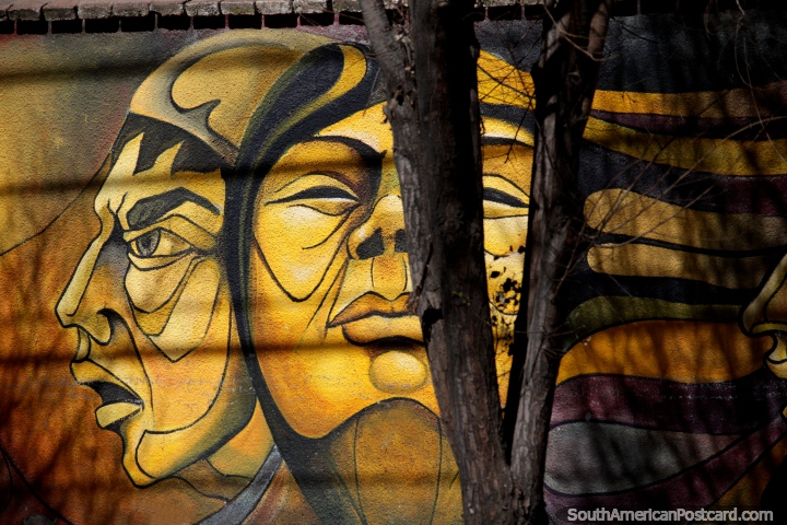 Fantastic street art in Oruro of indigenous faces painted in yellow. (720x480px). Bolivia, South America.