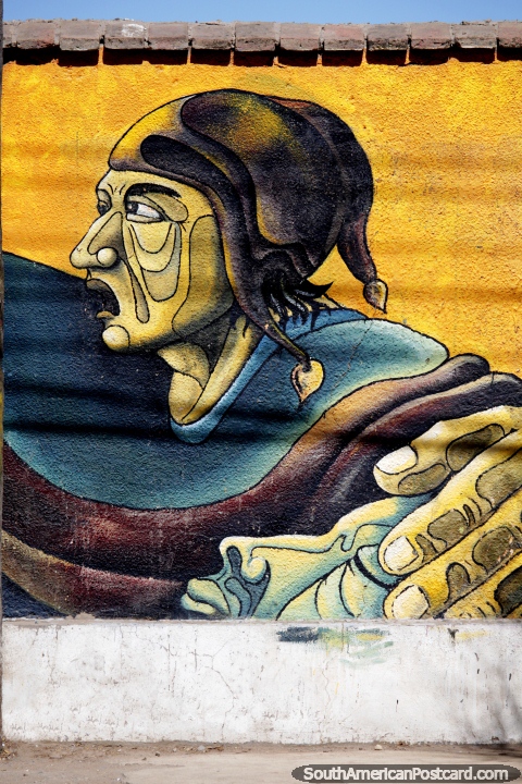 Indigenous man has his hand on the head of a sleeping goddess, colorful street art in Oruro. (480x720px). Bolivia, South America.
