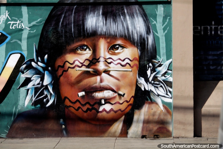 With wood through his nose and mouth, an indigenous man, work of street art in Cochabamba. (720x480px). Bolivia, South America.
