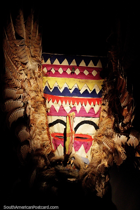 Mask with feathers from the Chaco region near Paraguay, used in the dance called Los Anas, Musef museum, La Paz. (480x720px). Bolivia, South America.