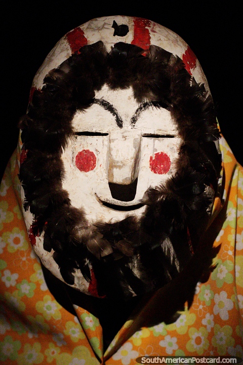 Mask with rosy cheeks, Ana Ana, made from wood and feathers, Tarija region, Musef museum, La Paz. (480x720px). Bolivia, South America.
