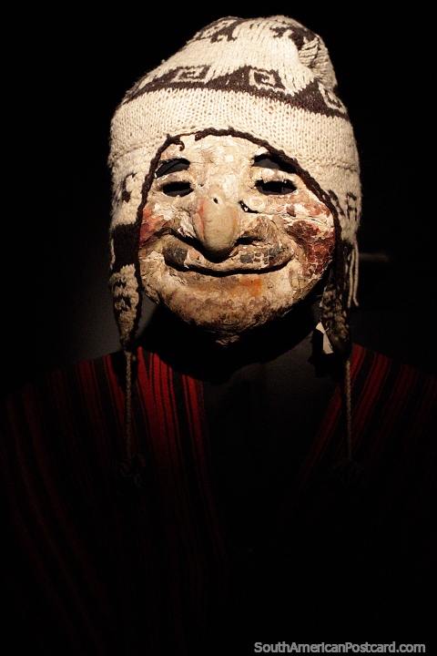 Archachila, old plaster mask with a woolen hat, Ulla Ulla region, 20th century, Musef museum, La Paz. (480x720px). Bolivia, South America.