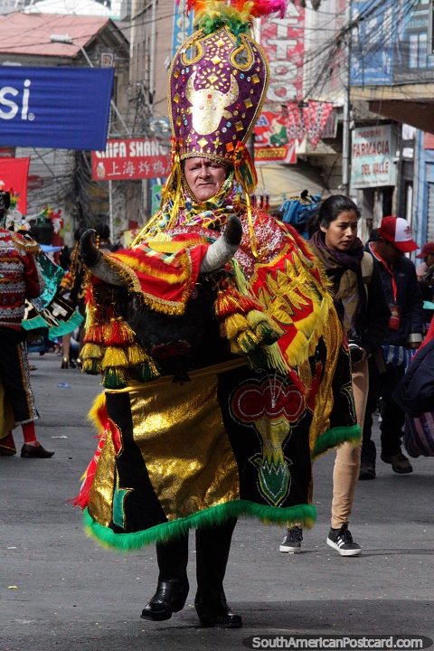 King rides a bull, a very elaborate costume for the El Gran Poder parade in La Paz. (480x720px). Bolivia, South America.