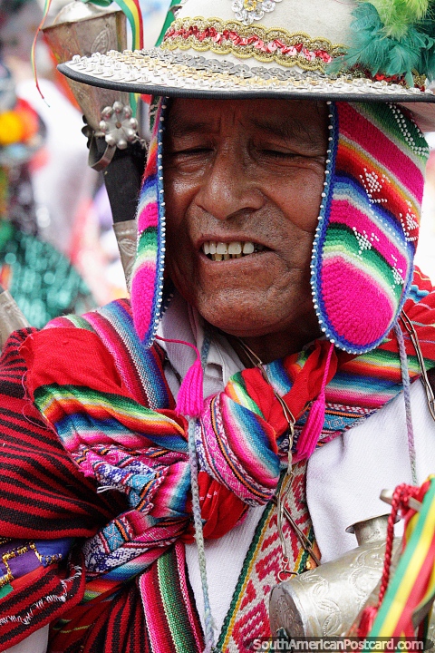 Bolivian man dances and enjoys the fantastic El Gran Poder parade in La Paz. (480x720px). Bolivia, South America.