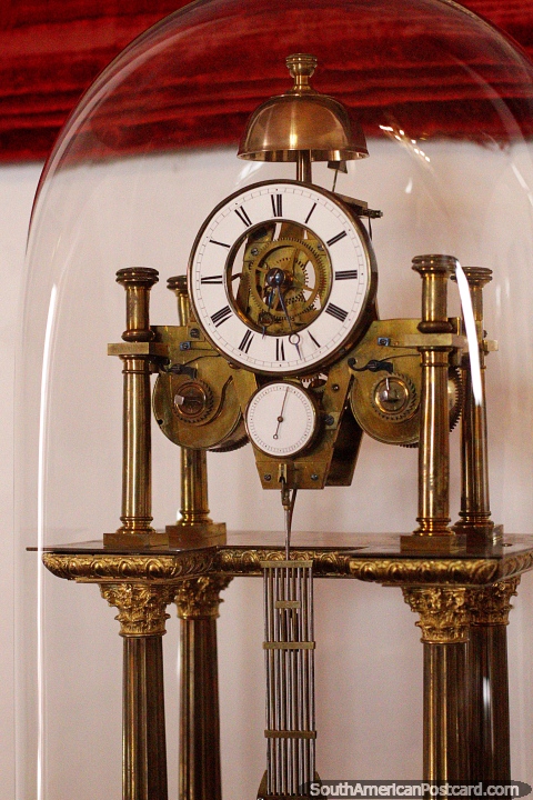 European clock that belonged to D.D Juan Jose de Segovia y Liendo in a glass beacon with exposed machinery, Freedom House, Sucre. (480x720px). Bolivia, South America.