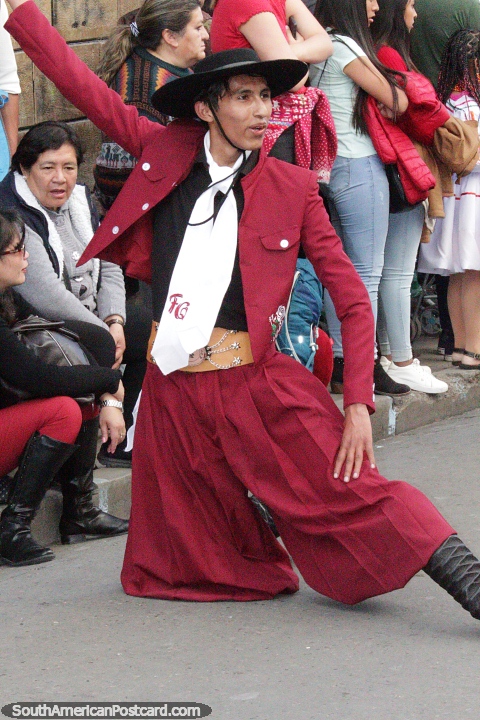 Man in a smart traditional outfit with large white tie and black hat, a spectacular dance move at El Gran Poder parade in Sucre. (480x720px). Bolivia, South America.