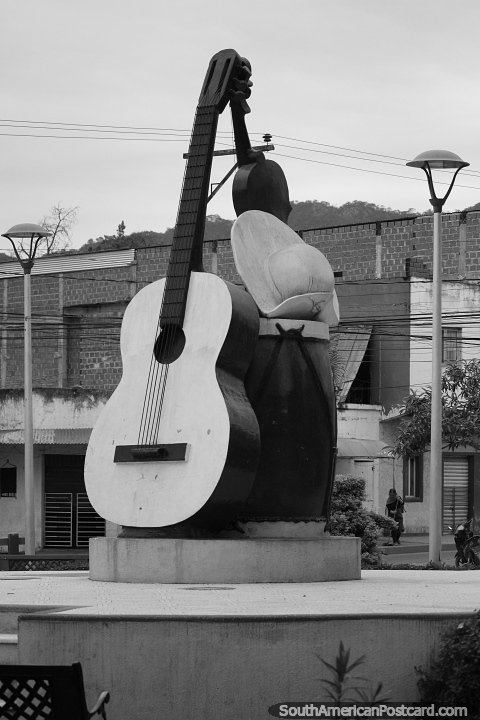 Cultural monument featuring a guitar, other instruments and a hat in Yacuiba. (480x720px). Bolivia, South America.