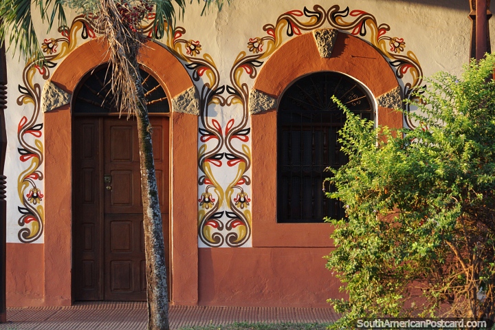 Nice facade with arches with painted designs and patterns beside the cathedral in San Ignacio de Velasco. (720x480px). Bolivia, South America.