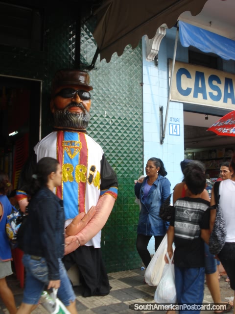 Bar Jangadeiro in Centro Manaus has 2 large mannequin men standing outside. (480x640px). Brazil, South America.