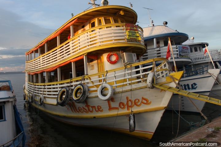 A yellow ferry glows a little as the sun goes down in Santarem. (720x480px). Brazil, South America.