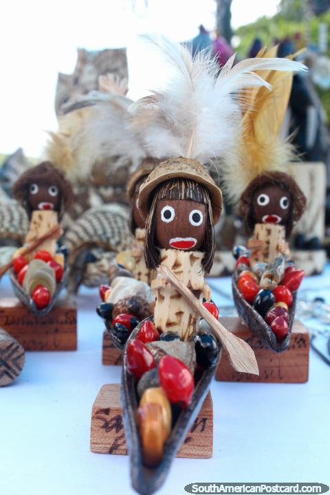 Small wooden figures in canoes, souvenirs at Alter do Chao near Santarem. (480x720px). Brazil, South America.