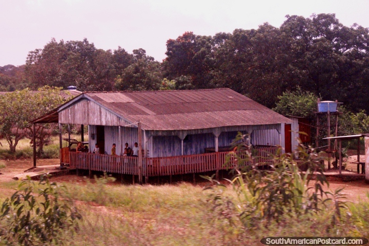 Family on the porch of their house in the far north/east, south of Oiapoque. (720x480px). Brazil, South America.
