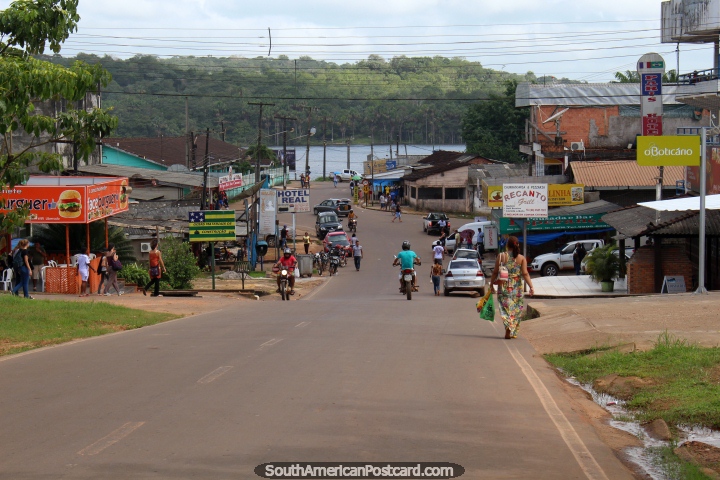 View down a central Oiapoque street towards the Oyapock River and French Guiana. (720x480px). Brazil, South America.