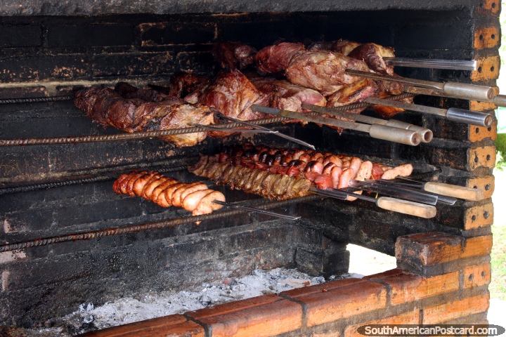 Meat barbecuing outside a restaurant in Oiapoque. (720x480px). Brazil, South America.