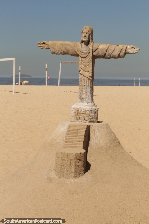 Christ the Redeemer made of sand at the beach in Copacabana, Rio de Janeiro. (480x720px). Brazil, South America.