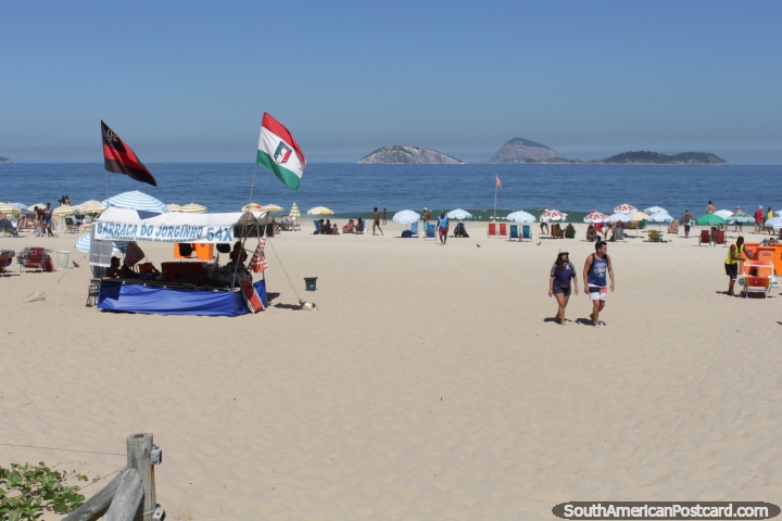 People enjoying Ipanema Beach in Rio de Janeiro, white sands and small islands. (720x480px). Brazil, South America.