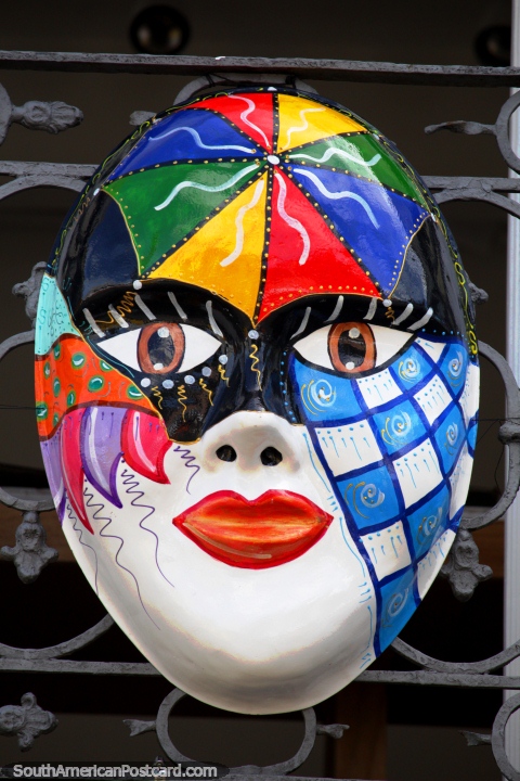 Colorful face mask with an umbrella on the forehead, Salvador carnival. (480x720px). Brazil, South America.