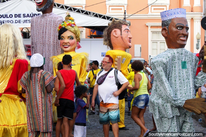 Huge puppets (munecos) out on the streets mingling with the people in Salvador at carnival time. (720x480px). Brazil, South America.