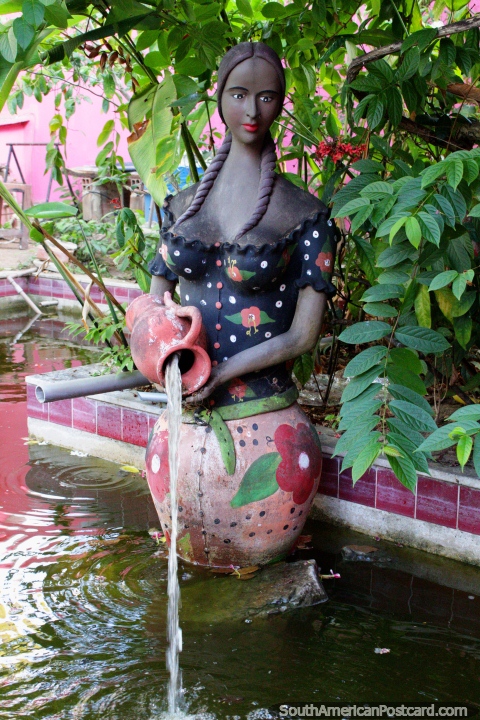 Ceramic woman pours water, gardens and water feature in Olinda. (480x720px). Brazil, South America.