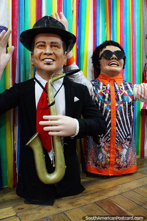 A pair of musicians, one with saxophone, the Boneco museum in Olinda. (480x720px). Brazil, South America.