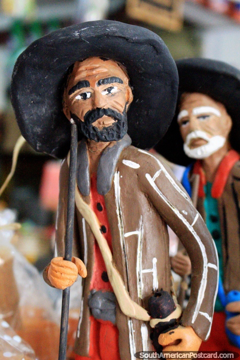 Male figurine with cowboy hat and holding a stick, arts and crafts cultural in Sao Luis. (480x720px). Brazil, South America.