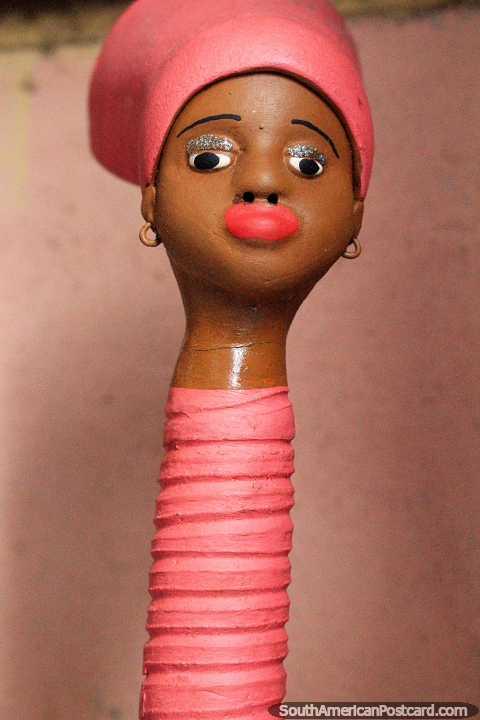 African female in pink with a long neck. Sao Luis is known for great arts and crafts. (480x720px). Brazil, South America.