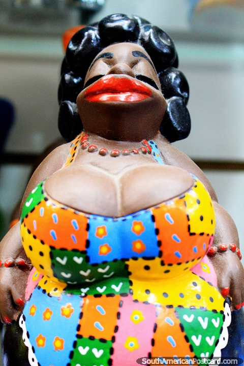 Woman with colored dress, big red lips and black hair, cultural figure, Central Market, Belo Horizonte. (480x720px). Brazil, South America.