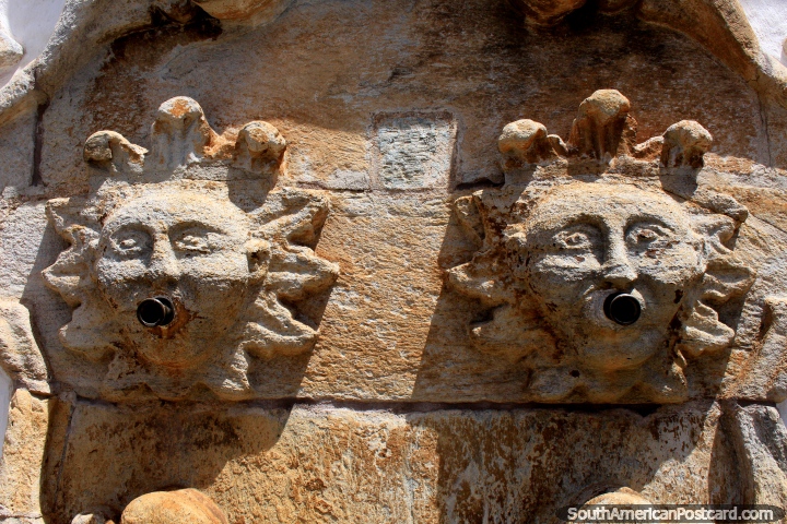 Ancient sun faces, a fountain on the front facade of the Conspiracy Museum in Ouro Preto. (720x480px). Brazil, South America.