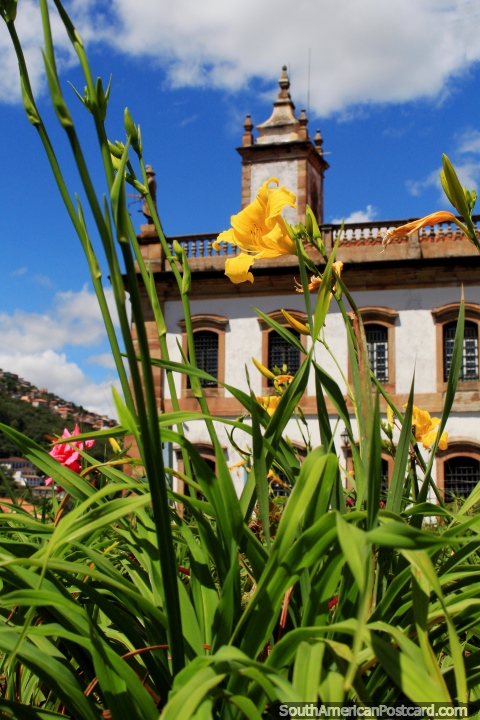 Flower gardens combined with Baroque style buildings and blue skies in Ouro Preto. (480x720px). Brazil, South America.
