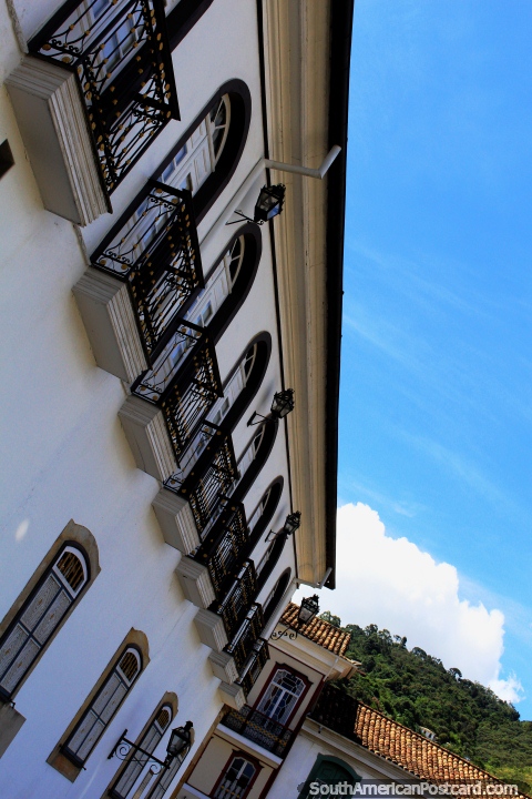 Pristine and decorated windows and iron balconies are a feature of Ouro Preto. (480x720px). Brazil, South America.