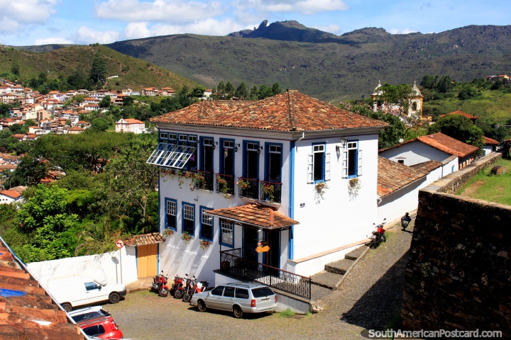 Foreground restaurant, distant church and mountains in Ouro Preto, a pretty location. (720x480px). Brazil, South America.