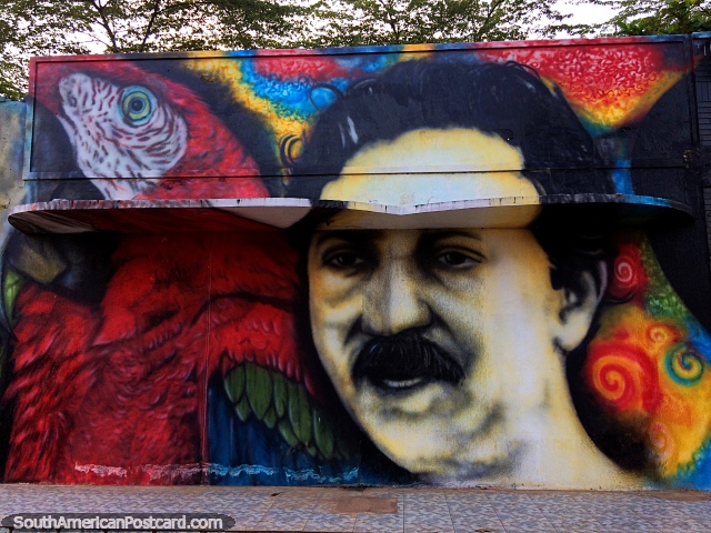 Chico Mendes (1944-1988) y una guacamaya roja, amante de la naturaleza y ecologista, arte callejero en Brasileia. (640x480px). Brasil, Sudamerica.