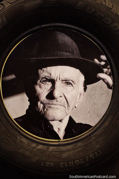 Euzkadi tire, an old man in a black hat, a rubber tapper, the rubber museum in Rio Branco. (480x720px). Brazil, South America.