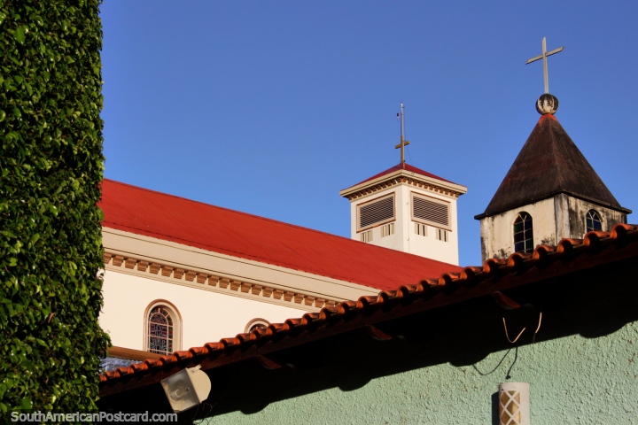 2 of the cathedral towers, the red roof and green hedge in Rio Branco. (720x480px). Brazil, South America.