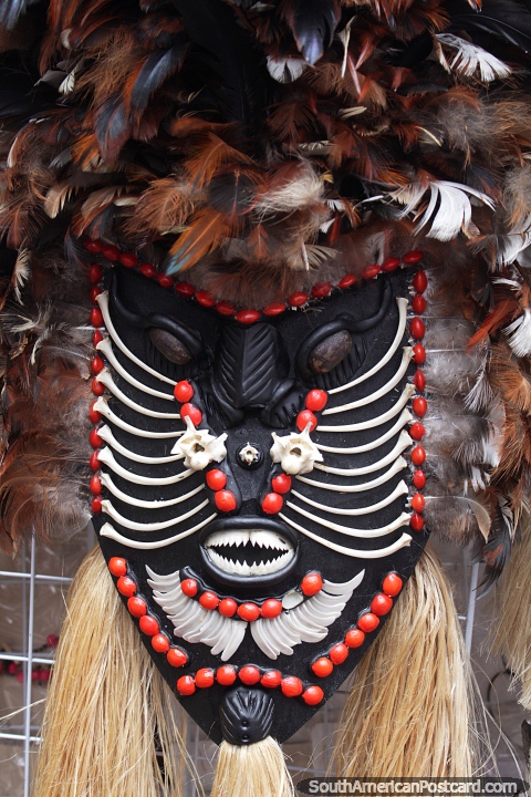 Native mask made with feathers, rope and bone, Manaus markets. (480x720px). Brazil, South America.