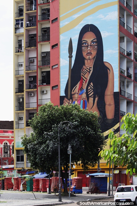Young indigenous woman with a spear, huge mural on a building side in Manaus. (480x720px). Brazil, South America.